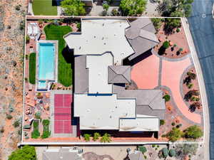 Aerial view of property and surrounding area with a pool area and property boundaries highlighted