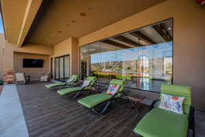 Wooden deck featuring a patio area