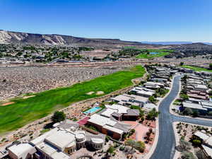 Aerial view of residential area with mountains and a local golf course