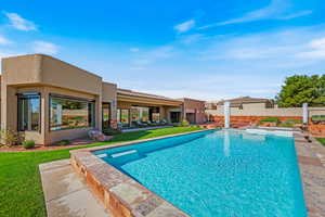 View of swimming pool featuring a patio and a fenced backyard