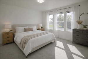 Bedroom featuring light colored carpet