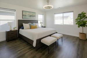 Master Bedroom with multiple windows and dark wood finished floors