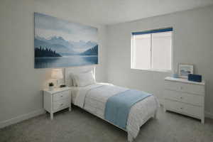 Carpeted bedroom featuring baseboards