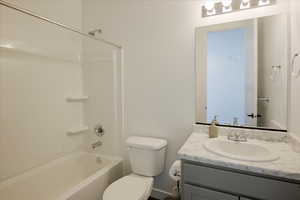 Bathroom with vanity and shower / bath combination