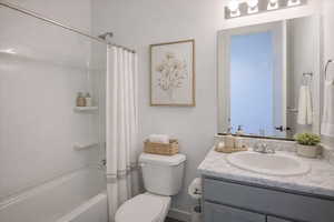 Bathroom with vanity and shower / bath combo