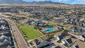 Aerial overview of property's location featuring a mountain backdrop and nearby suburban area