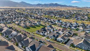 Aerial view of property and surrounding area with mountains