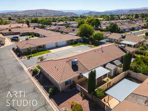 Aerial perspective of suburban area with a mountain backdrop