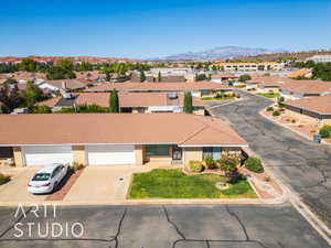 Aerial view of residential area featuring a mountain backdrop