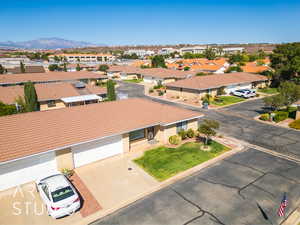 Aerial view of residential area featuring mountains
