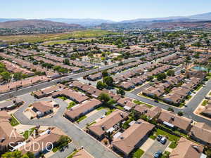 View of property location with a mountain backdrop and nearby suburban area