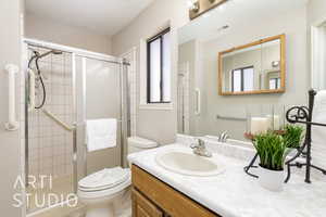 Full bathroom featuring vanity and a stall shower