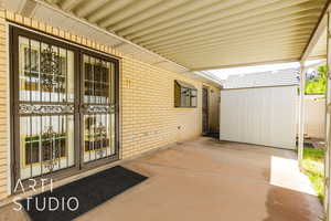 View of patio / terrace featuring a storage unit
