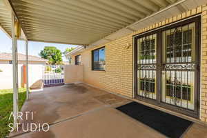 View of patio with a gate