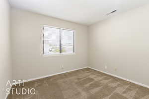 Unfurnished room featuring carpet and baseboards
