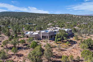 View of subject property featuring a forest