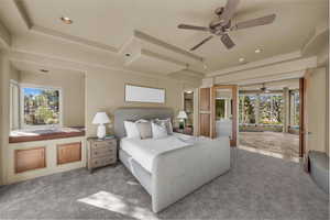 Bedroom featuring carpet flooring, recessed lighting, a ceiling fan, and a tray ceiling