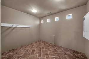 Basement featuring stone finish floors