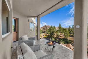 View of patio / terrace featuring an outdoor fire pit