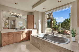 Full bath with vanity, a tub with jets, light tile patterned flooring, a shower stall, and recessed lighting