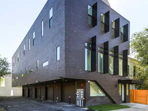 View of building exterior featuring a garage