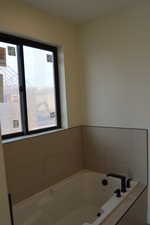 Full bath featuring a bath