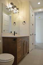 Half bath with vanity and recessed lighting