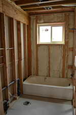 Full bath featuring a bathtub