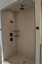 Full bath featuring a shower stall and recessed lighting