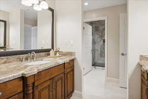 View of shower. Heated floor extends to shower and commode area.