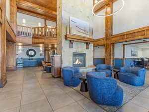 Community lobby with a towering ceiling and wood walls