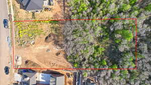 Expansive rectangular lot featuring a cleared building area and mature treeline