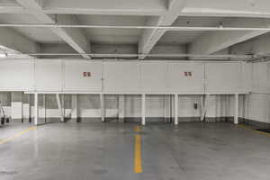 Two parking spaces side by side with Storage Lockers