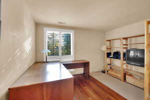 Office space featuring wood finished floors
