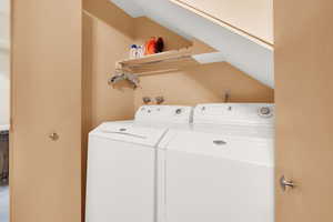 Laundry room featuring independent washer and dryer