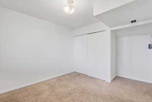 Bedroom with carpet floors and a closet