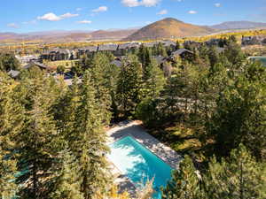 Bird's eye view of a mountainous background and a pool area