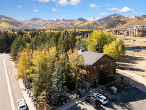 Aerial view of property and surrounding area with mountains
