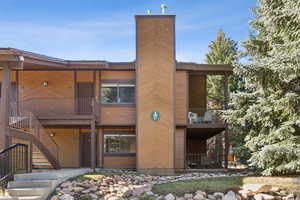 View of property featuring stairs