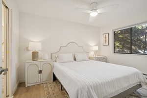 Bedroom featuring wood finished floors and ceiling fan