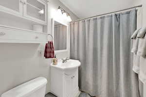 Full bath featuring vanity and a shower with curtain