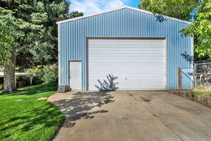 Detached garage with concrete driveway