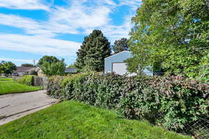 View of yard with an outbuilding