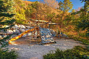 View of yard featuring a playground