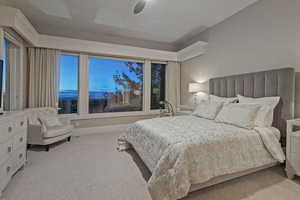 Bedroom with light carpet and ceiling fan