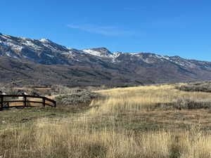 View of mountain backdrop featuring rural landscape