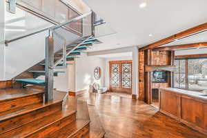 Kitchen featuring dark wood-style flooring, recessed lighting, and brown cabinetry