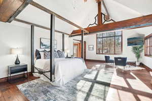 Bedroom with baseboards and dark wood-style flooring