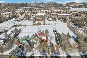 Snowy aerial view with a mountain view