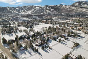 Snowy aerial view with a mountain view
